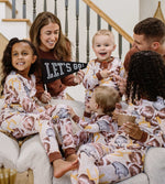 Load image into Gallery viewer, Full family wearing Burt&#39;s Bees Baby football holiday matching family pajamas
